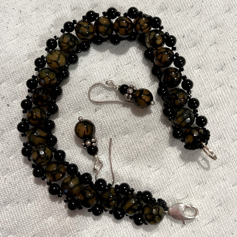 Black and tortoise color glass beaded bracelet/earrings set.